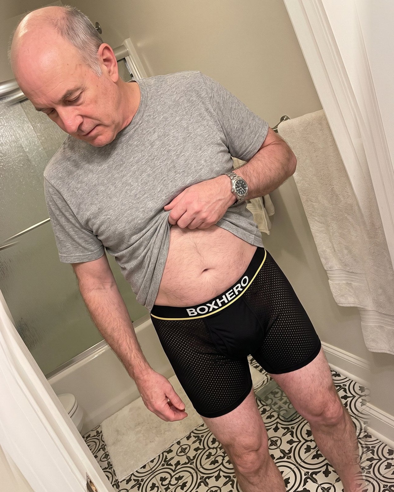 A BoxHero customer in his sixties showing his BoxHero 2.0 waistband