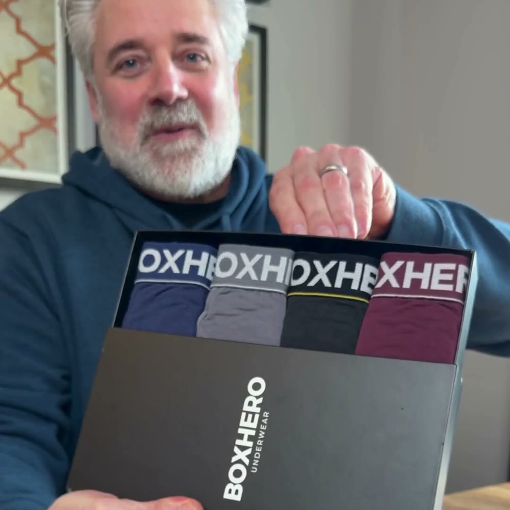 Man over 40 opening a BoxHero gift box