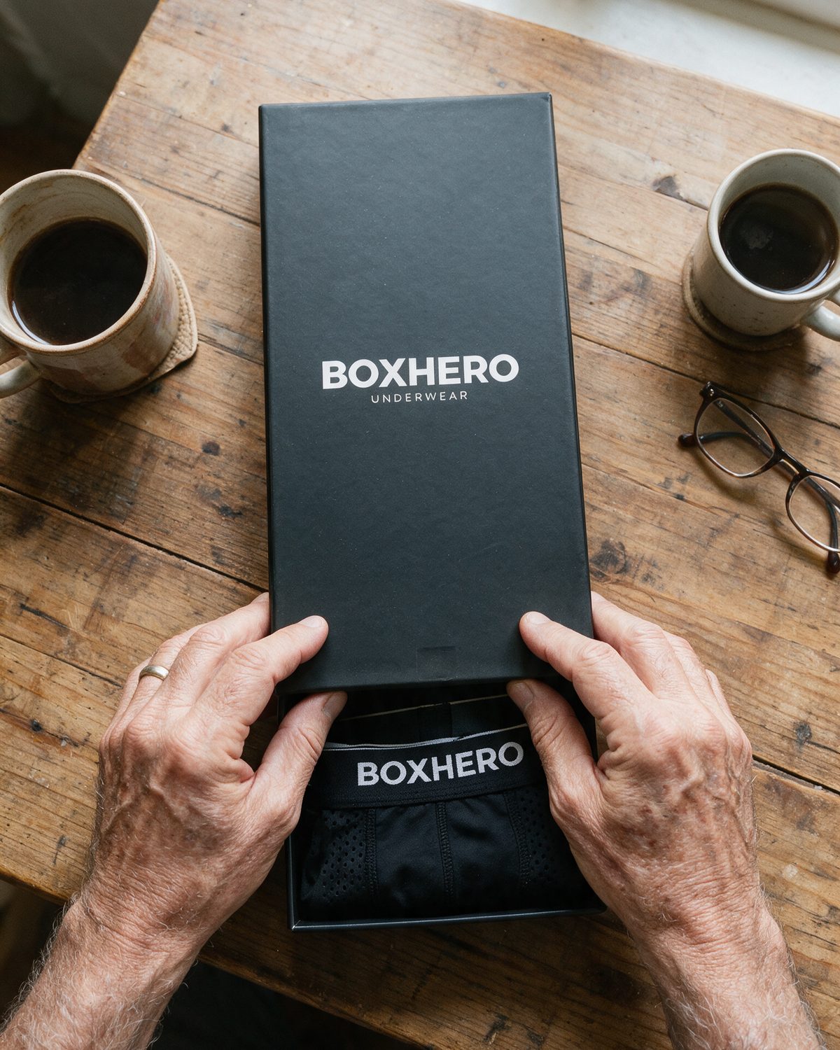 Opening the BoxHero box on the kitchen table